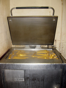 Liverwurst spread in cooker for boiling
